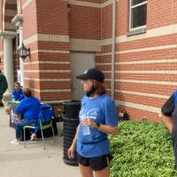 KC Christopher, Sara Maas, and Dr. Huizen wait for students to arrive